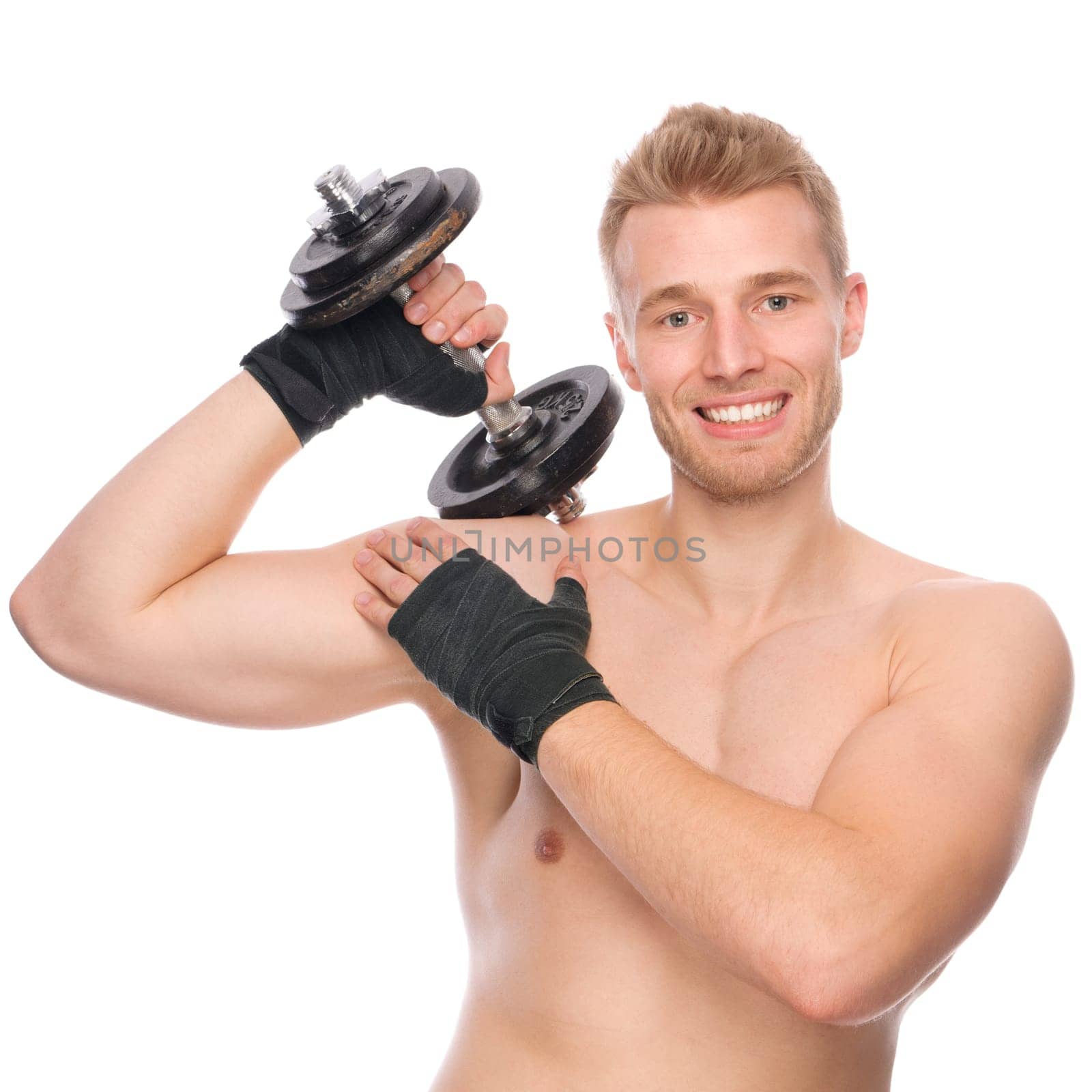 Studio shot of a young strength athlete against a white background