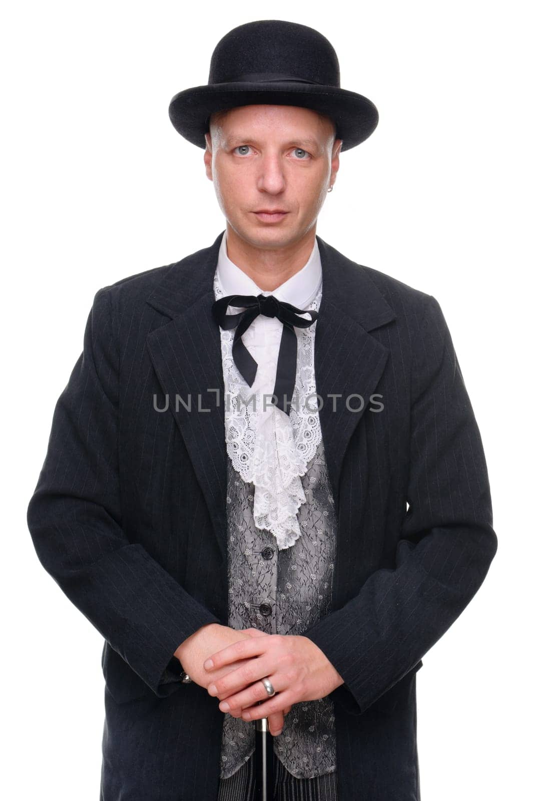 Man in western outfit against white background in studio
