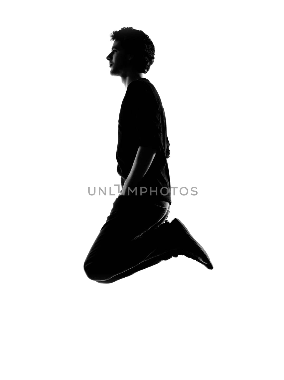 young man funny jumping silhouette in studio isolated on white background
