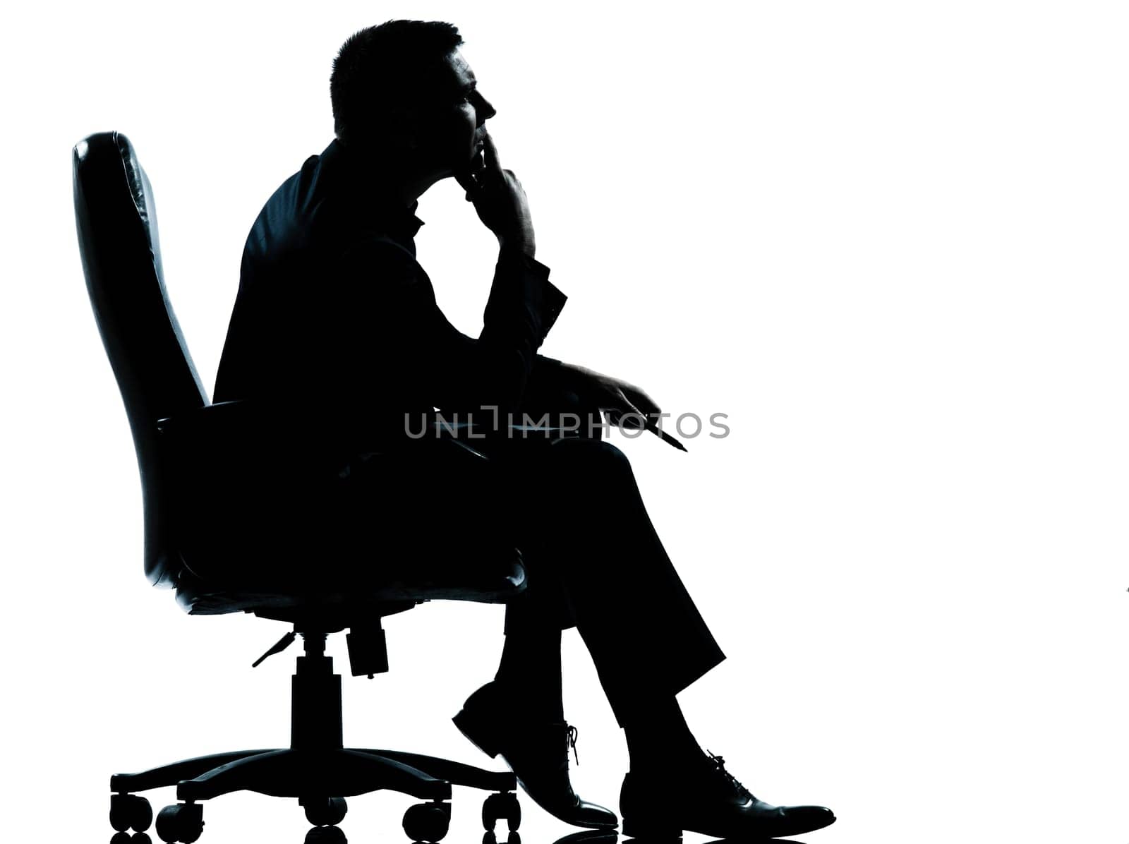 one caucasian business man sitting in armchair silhouette Full length in studio isolated on white background
