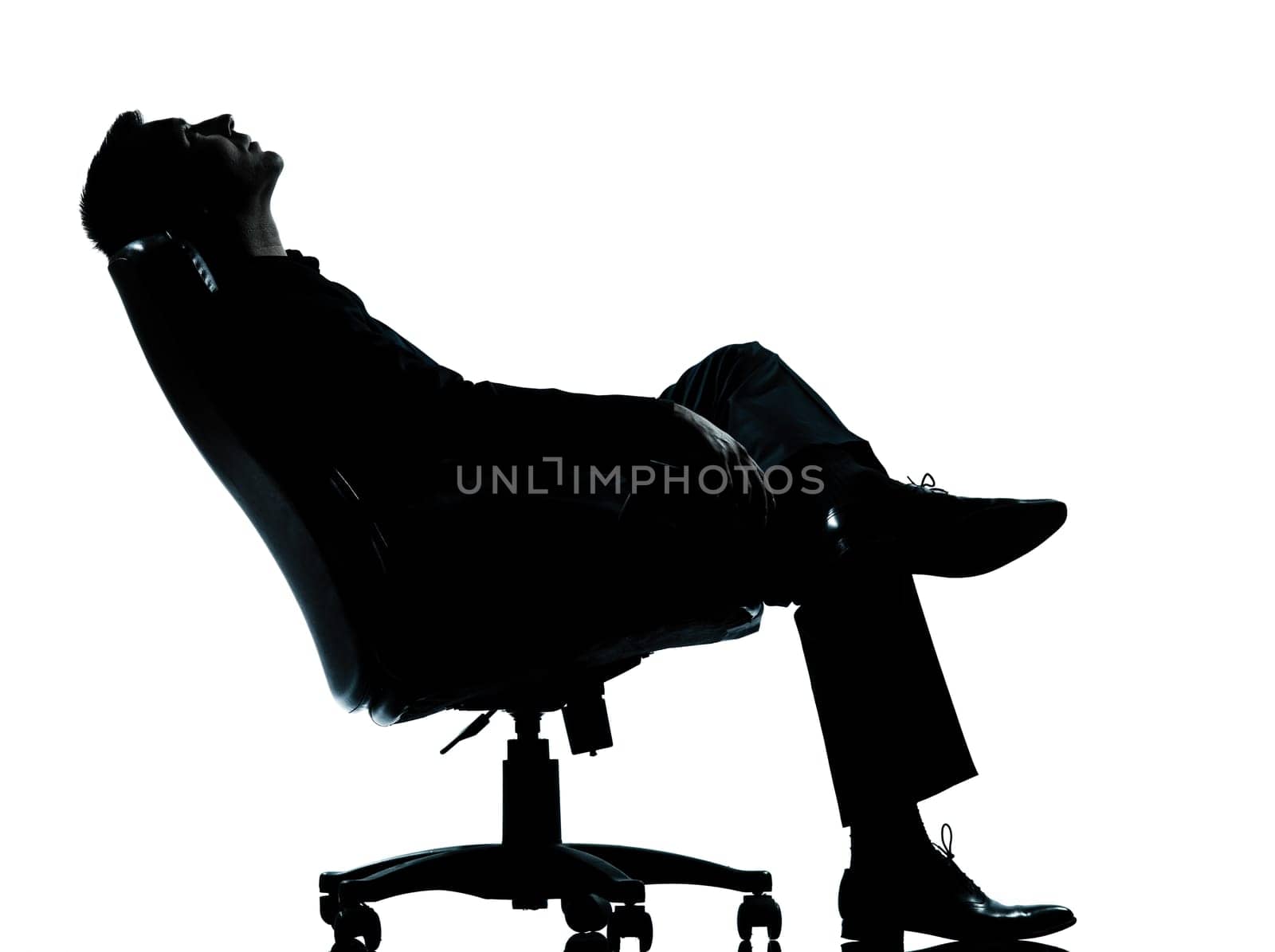 one caucasian business man relaxing thinking sitting in armchair silhouette Full length in studio isolated on white background