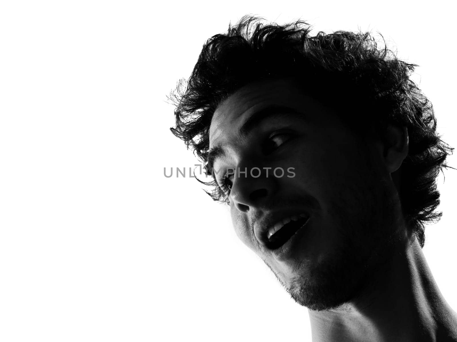 young man silhouette surpised in studio isolated on white background