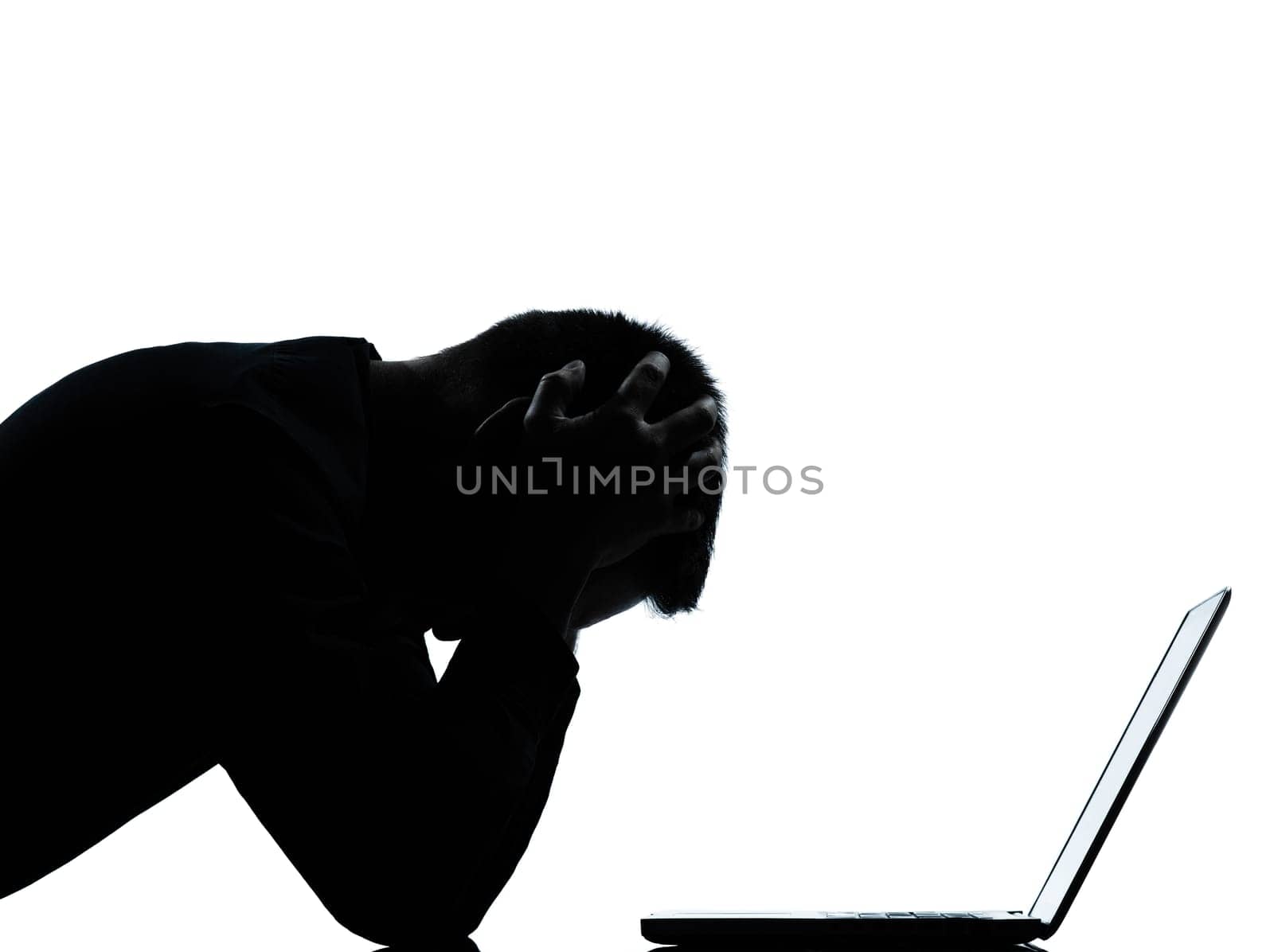 one caucasian business man computing computer laptop despair sad portrait silhouette in studio isolated on white background
