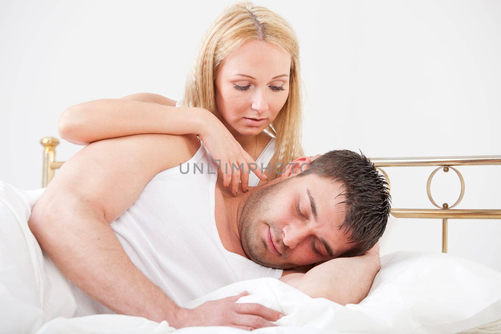 Romantic couple lying in bed