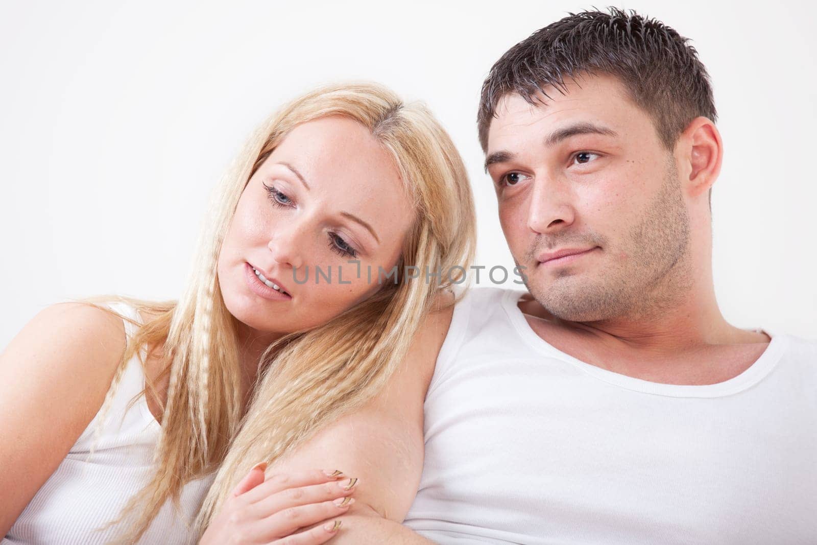 young love couple lying in bed