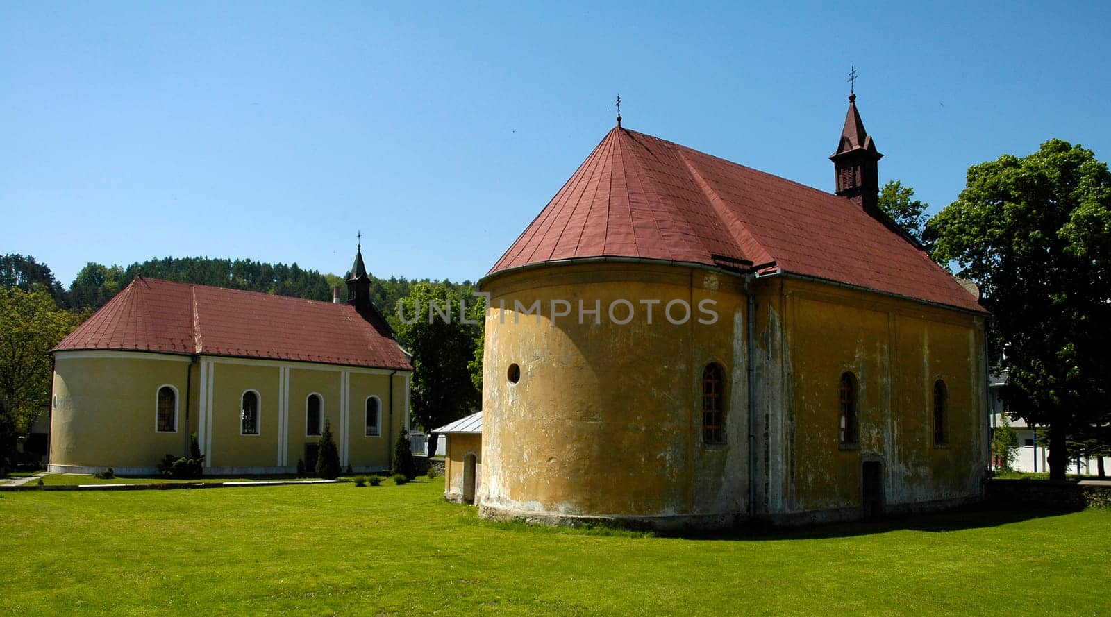 old chapels in Svidnik, Slovakia  clear blue sky, green grass