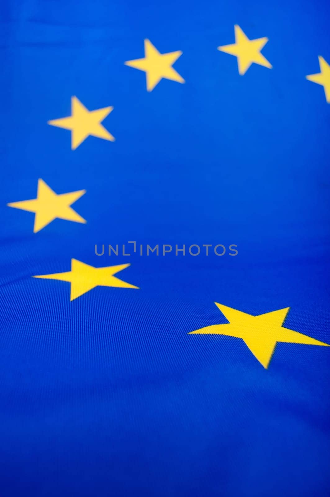 Closeup of Glossy Flag of European Union - EU Flag Drapery - Shallow Depth of Field
