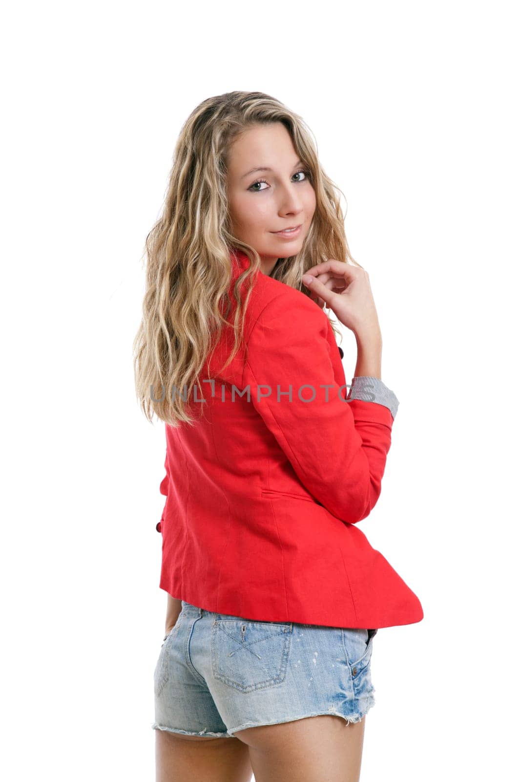Woman in short jeans and red jacket on white