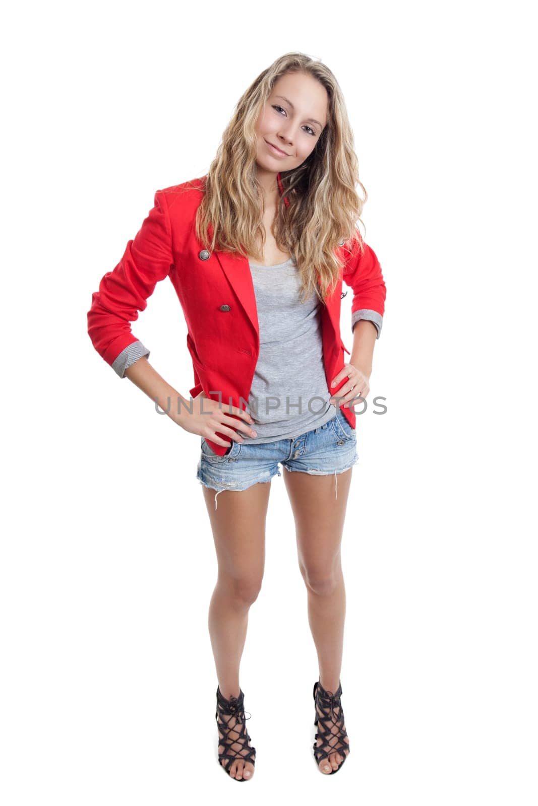 Woman in short jeans and red jacket on white