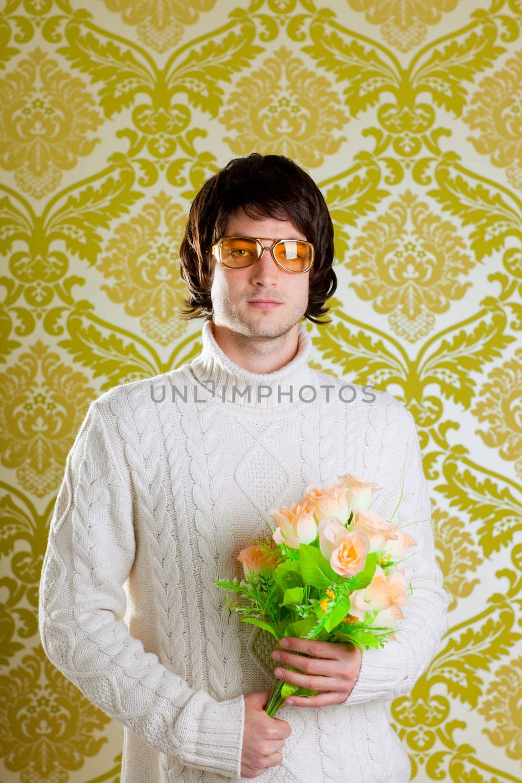 retro hip young man vintage glasses holding valentines flowers bouquet on wallpaper