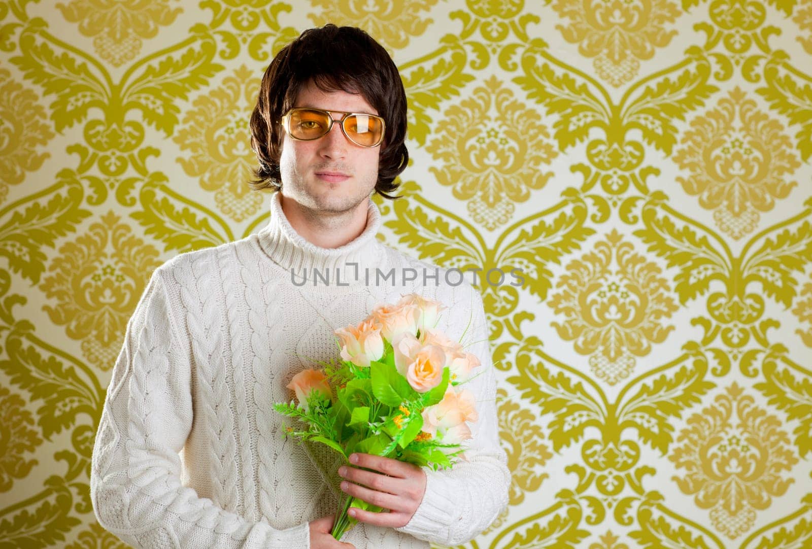 retro hip young man vintage glasses holding valentines flowers bouquet on wallpaper