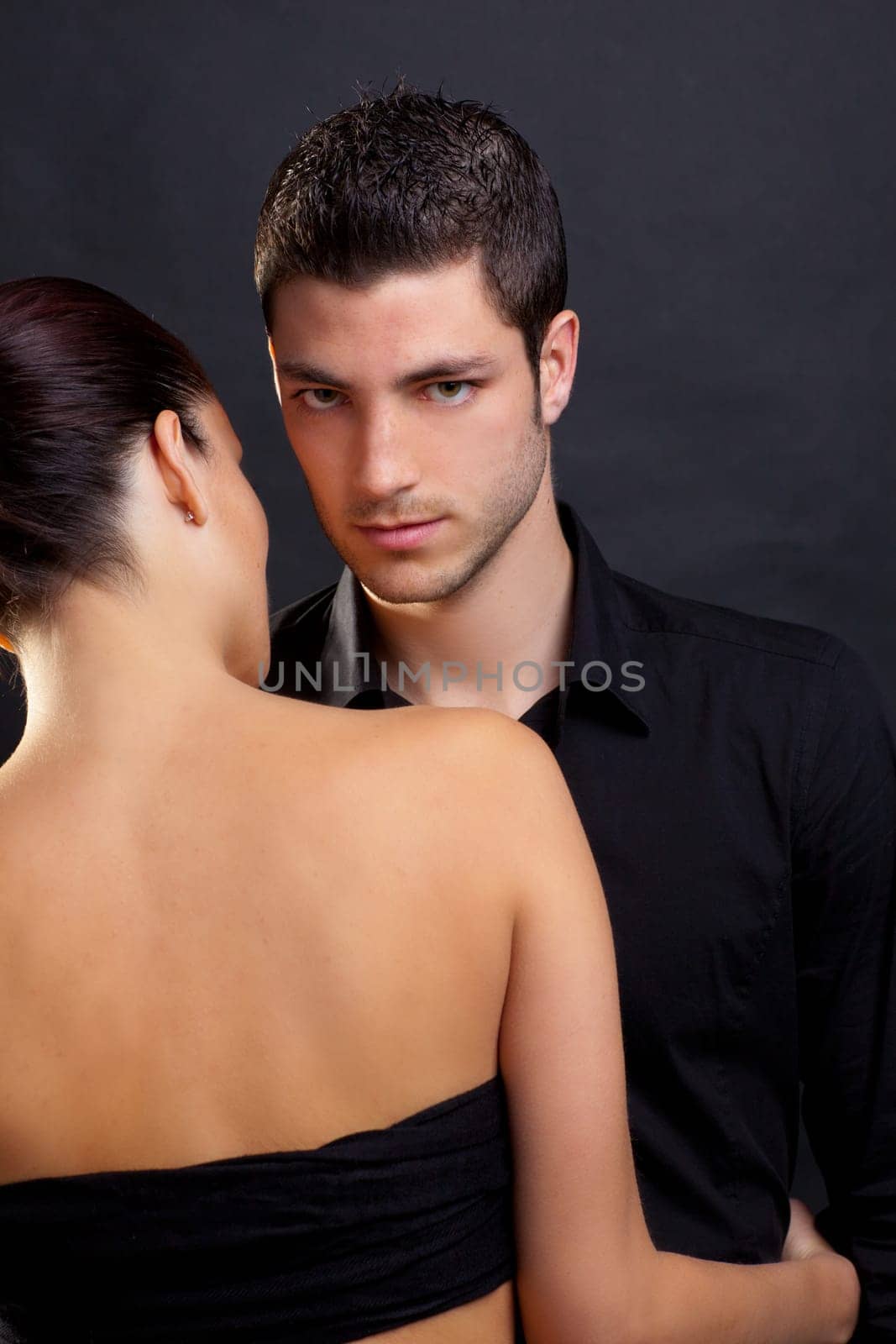 Couple in love with handsome man and rear profile woman nude back