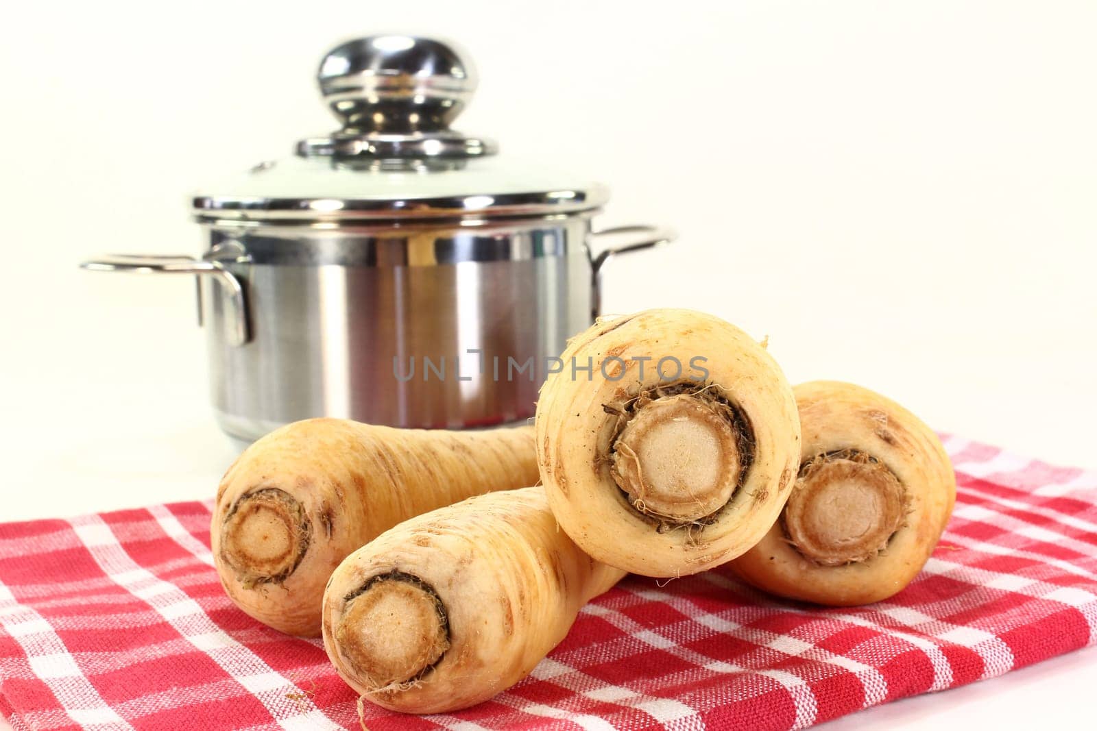 Parsnips on a red tea towel