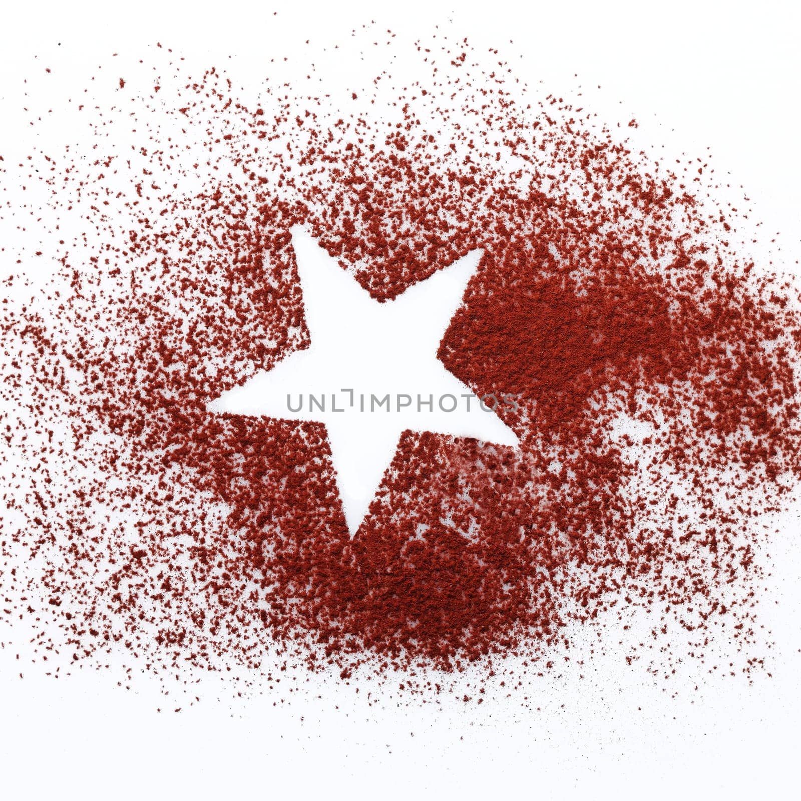 Crisp white star shape in the centre of randomly sprinkled cocoa or chocolate powder