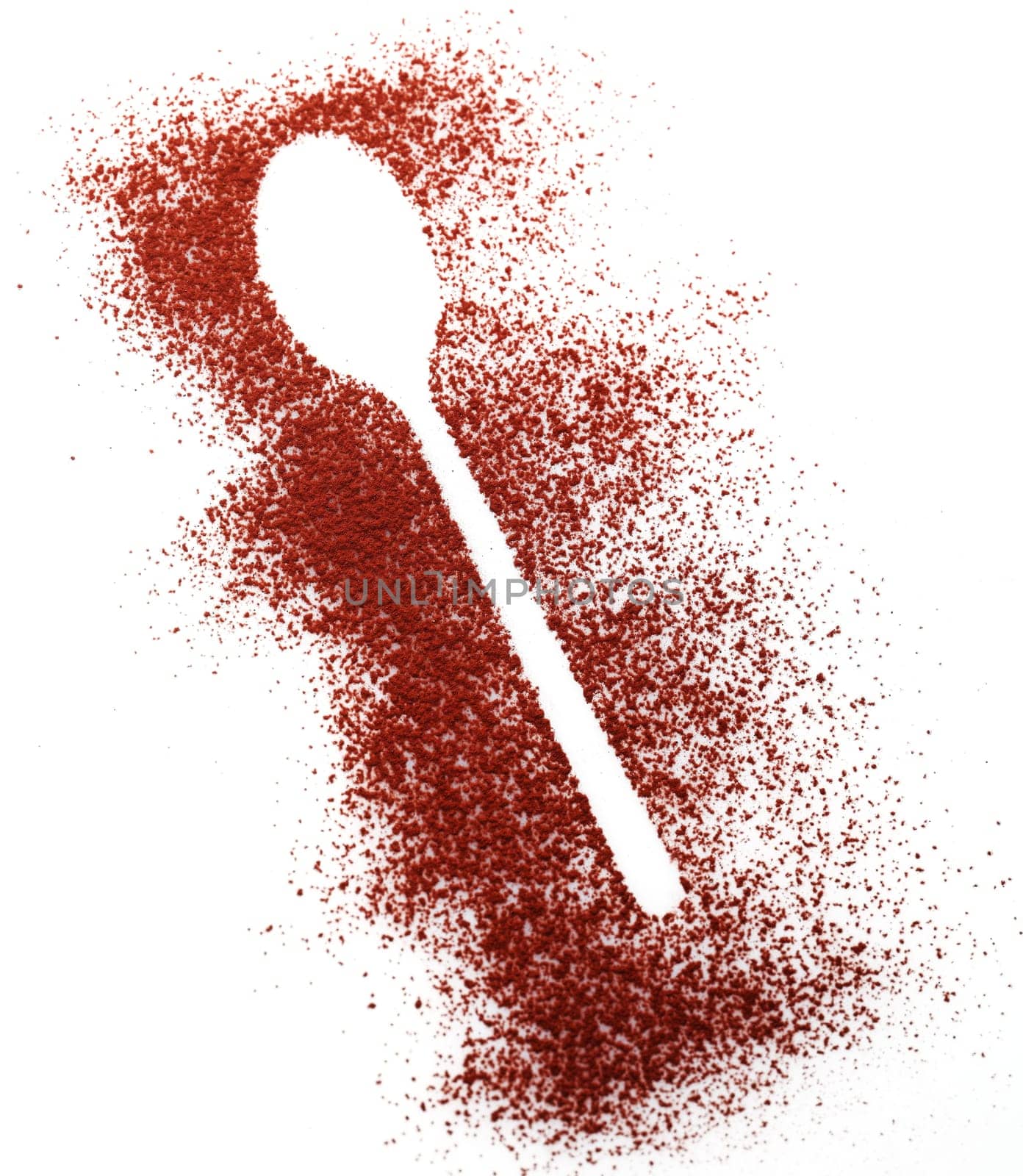 Crisp white shape of a spoon in randomly scattered cocoa or chocolate powder