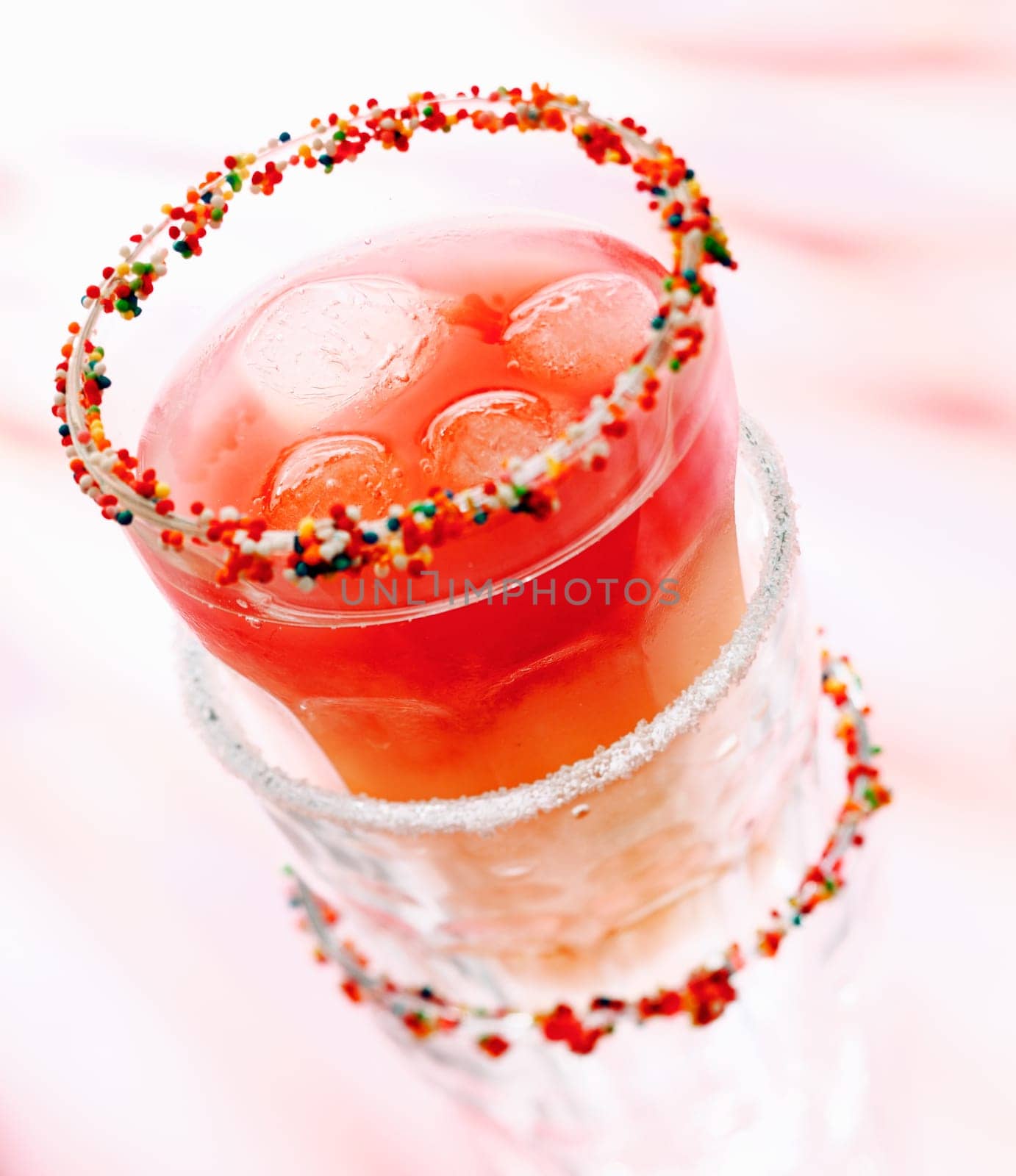 Cool Cherry Drink or Smoothie with ice cubes in stacked glasses for summmer cocktail concepts