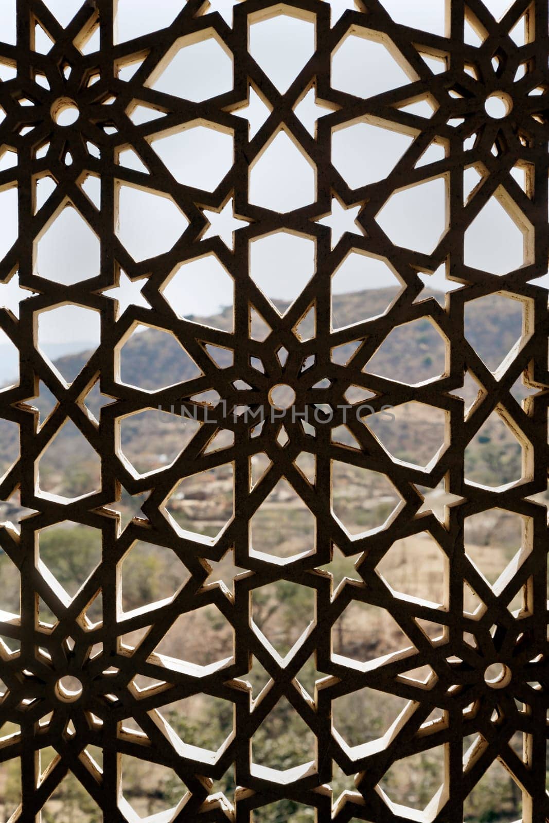 Indigenous concrete craft work of Rajasthan India on a window opening, grid design allows air and light circulation but prevents the nesting of birds