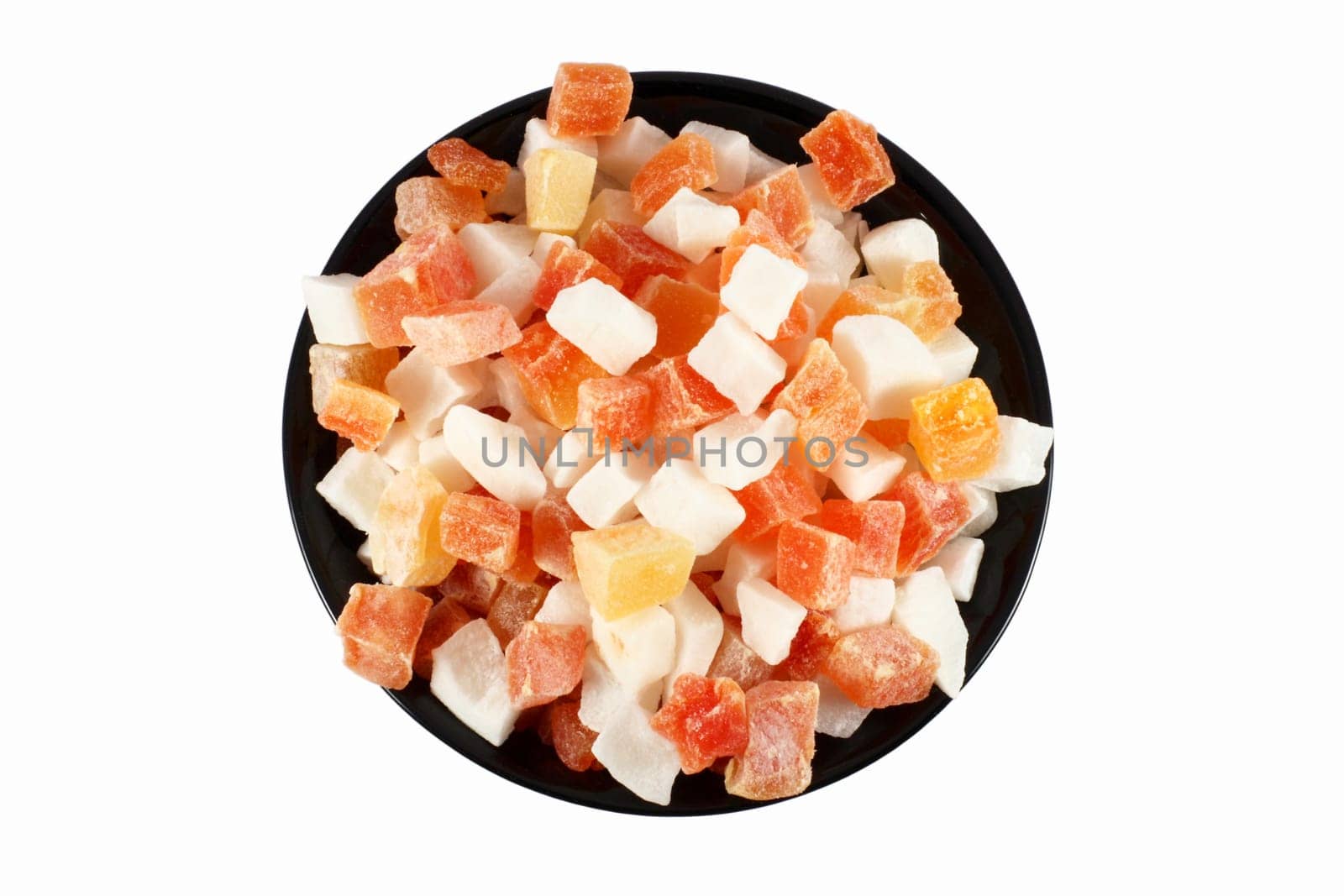 Black bowl full of dried papaya and coconut