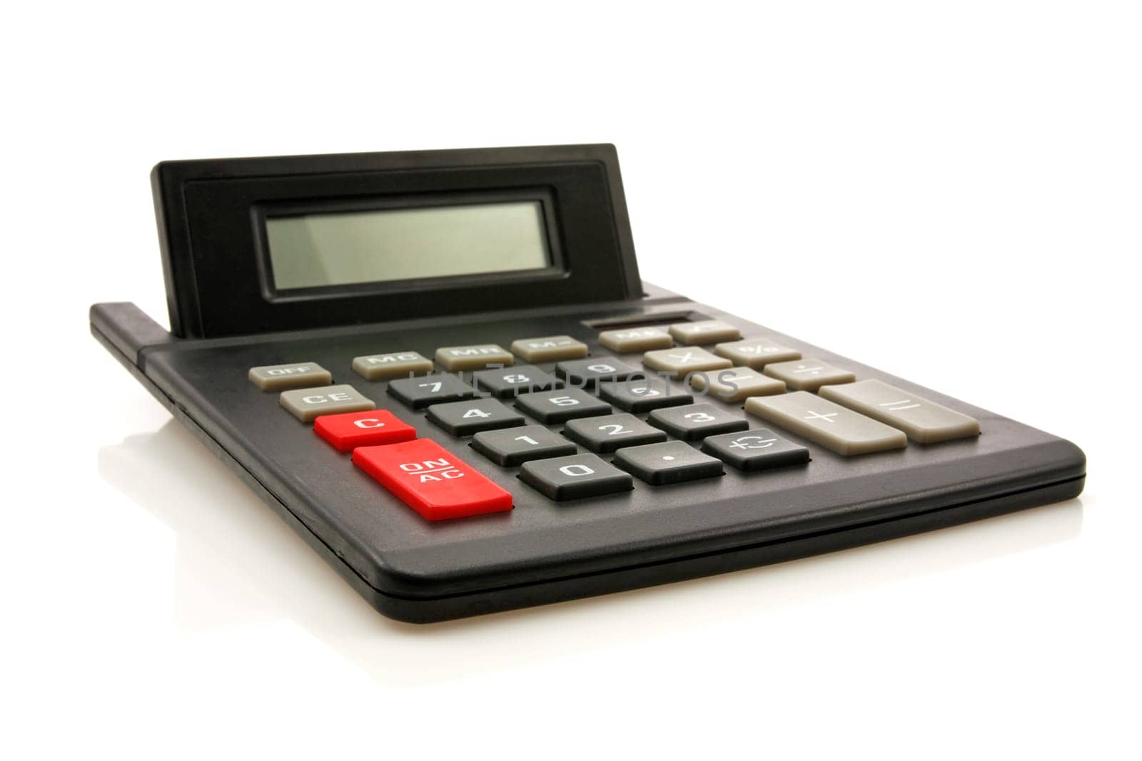 black calculator with reflection on white background