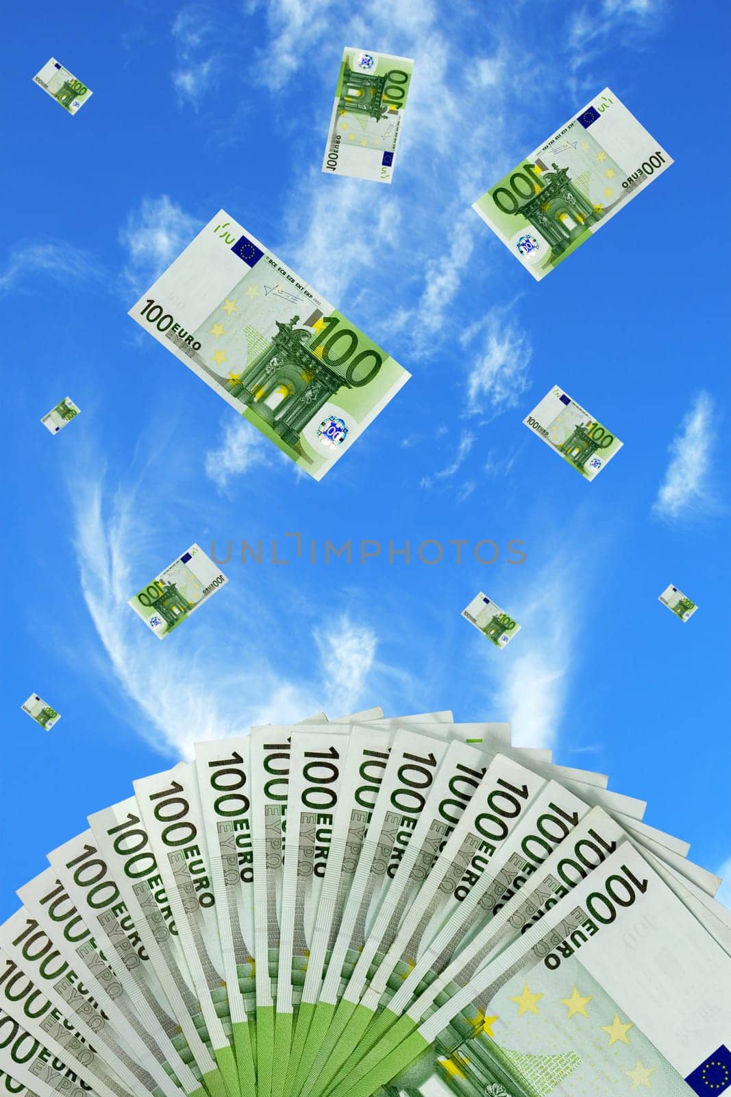 Euro bills falling in the sky background
