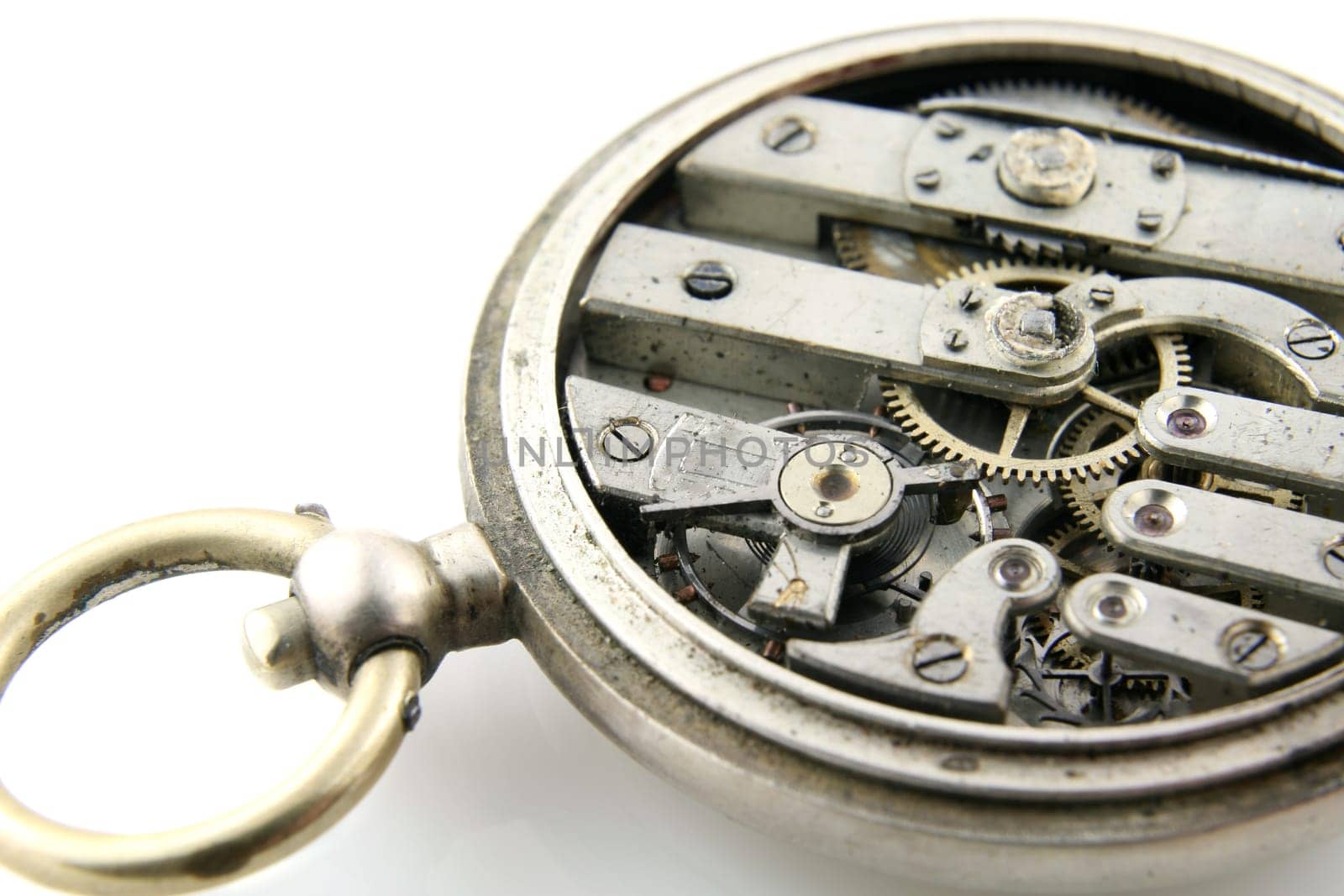 old pocket watch mechanism on white background