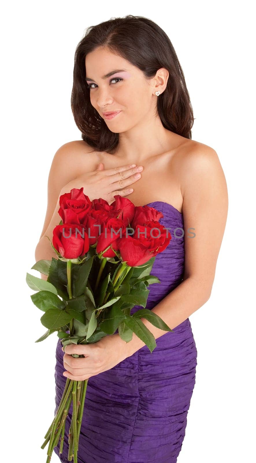 Woman in an evening dress is happily holding roses she just received