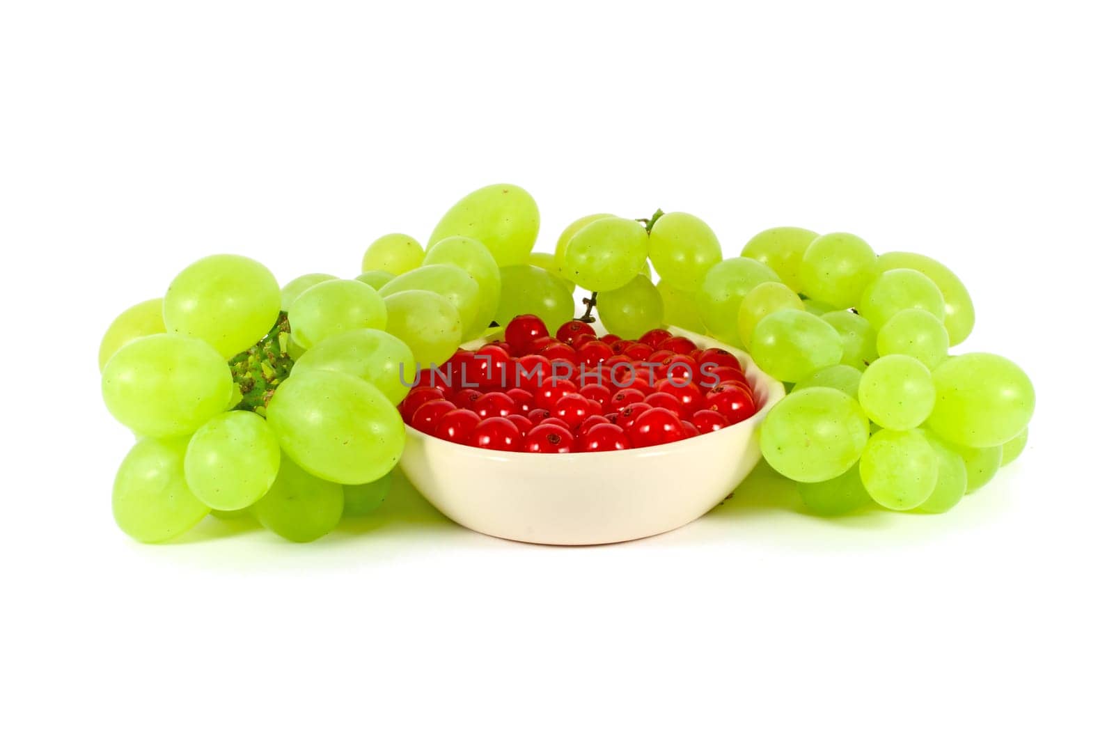 Grape and red currant isolated on white