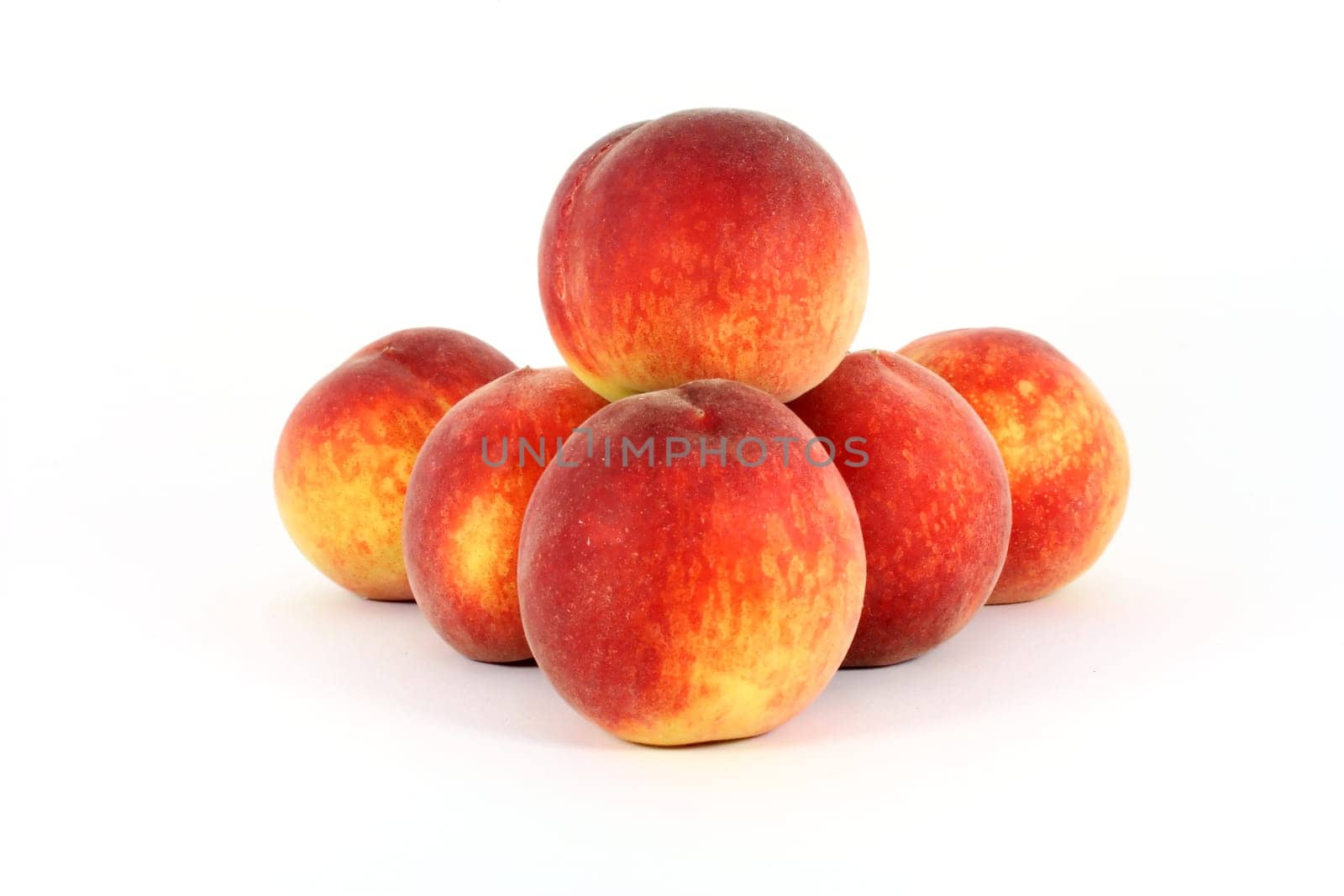 fresh colorful ripe peaches isolated on white