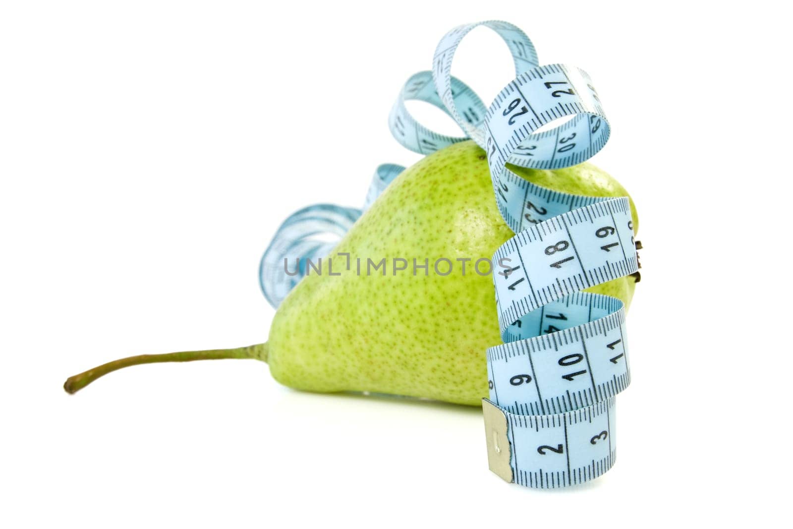 green pear wrapped by blue measure tape