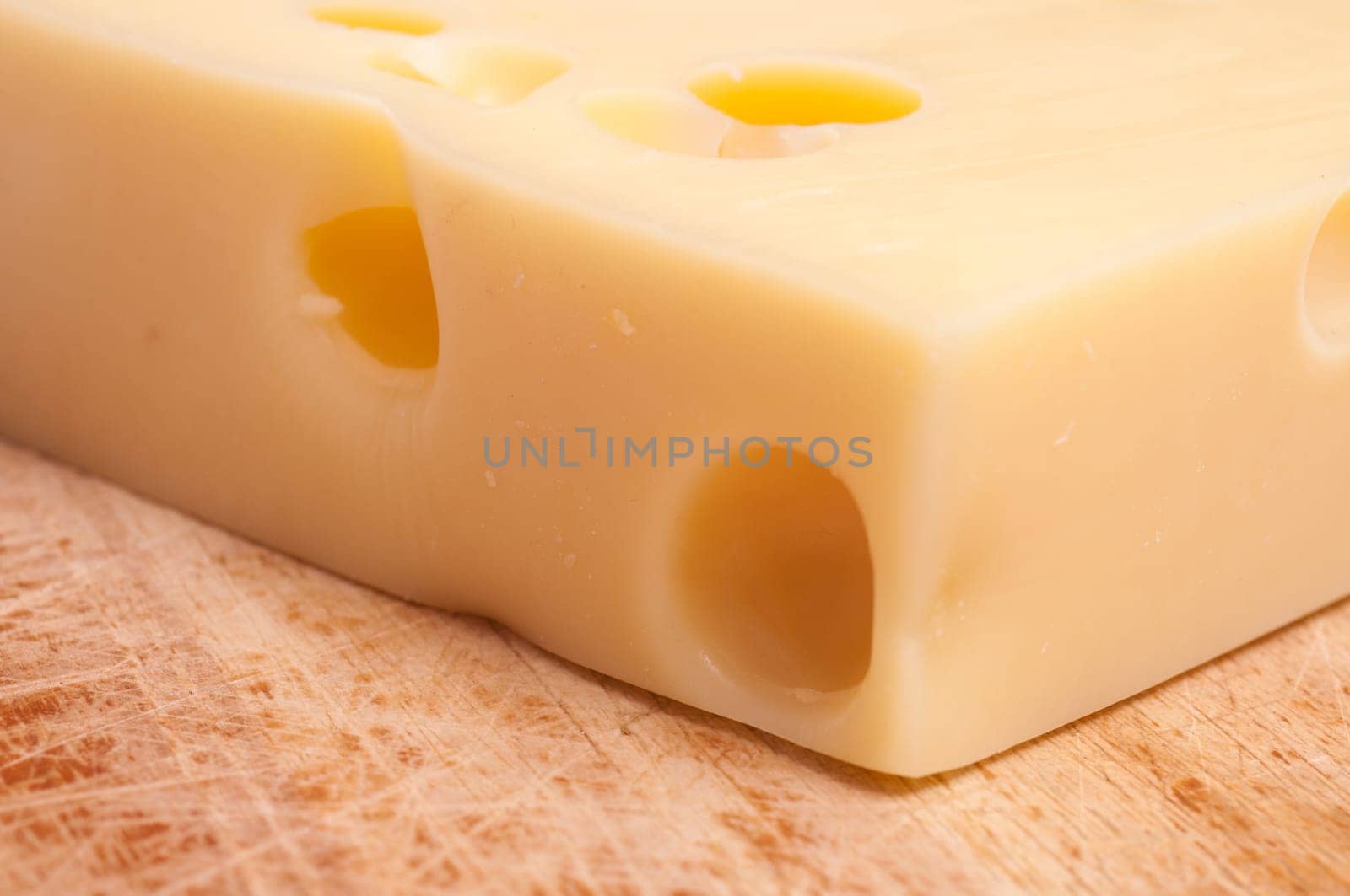 Swiss Emmental cheese and wooden board