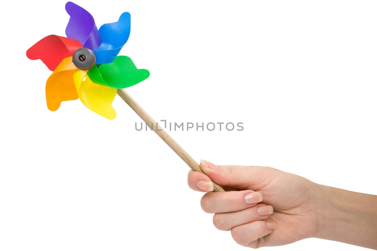 hand with a color pinwheel over a white background