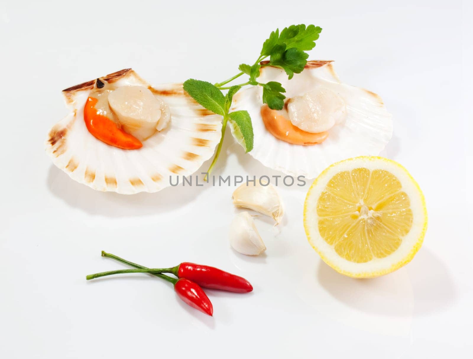 Cappesante and lemon on a white background