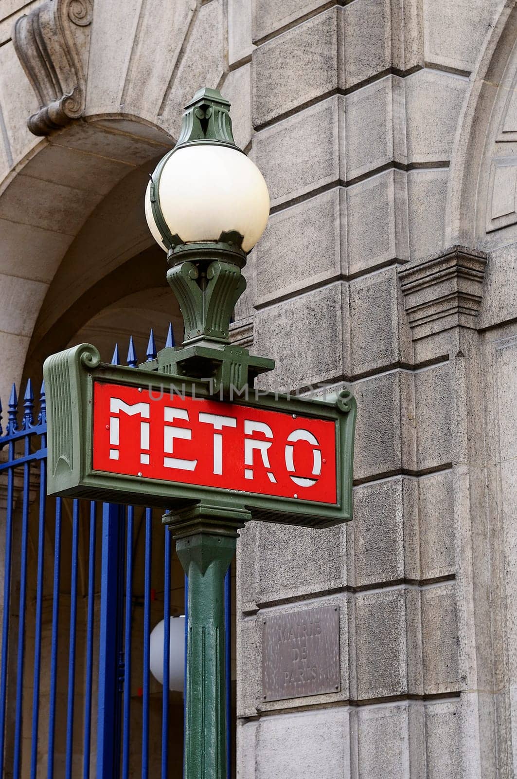 Red and green metro sign in Paris France