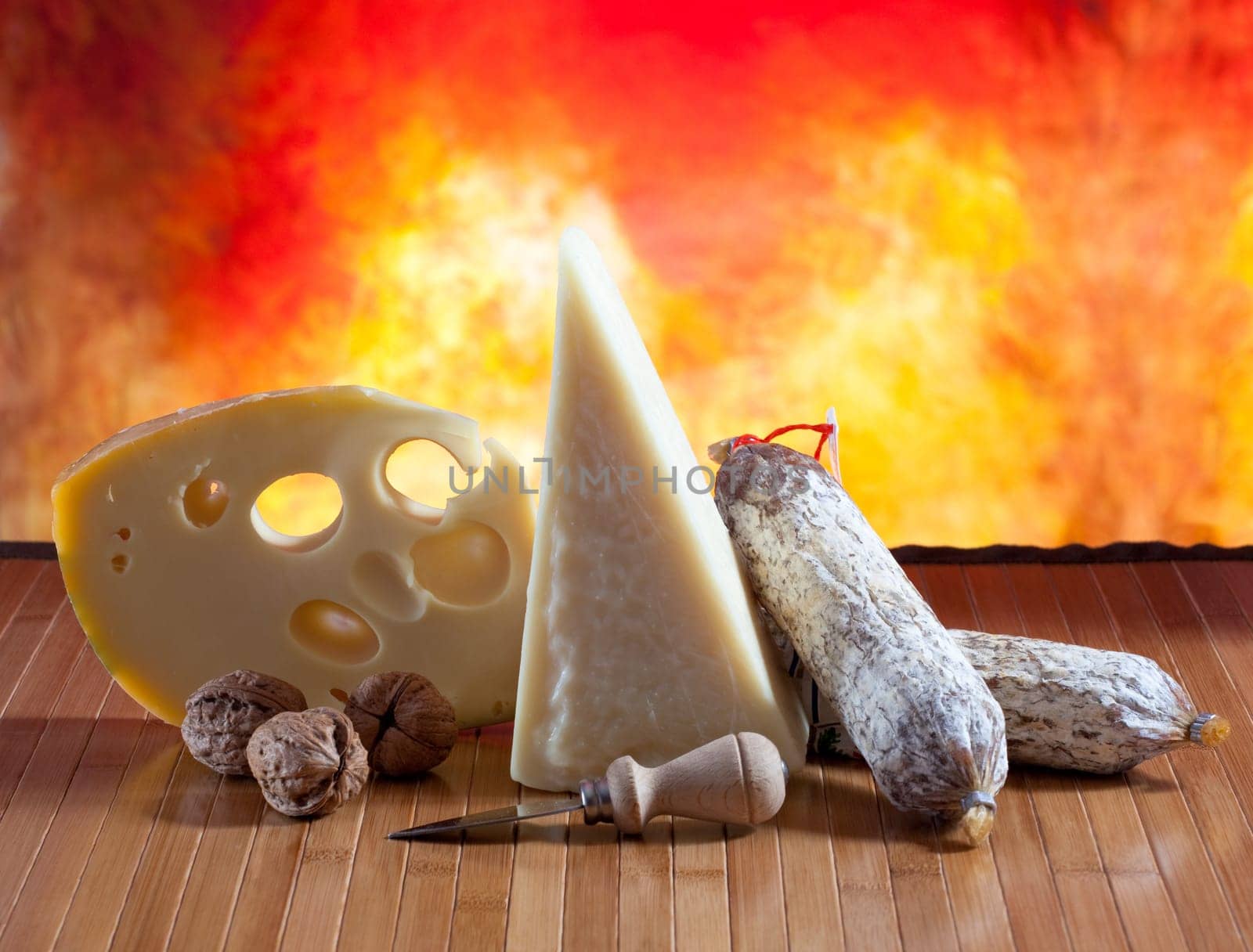 Italian cheese and salumi on a orange background