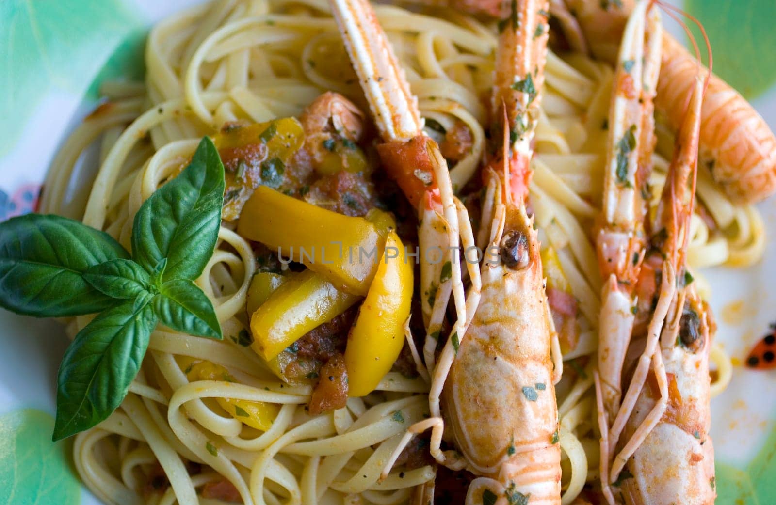 Italian spaghetti with tomato sauce, basil and shrimp