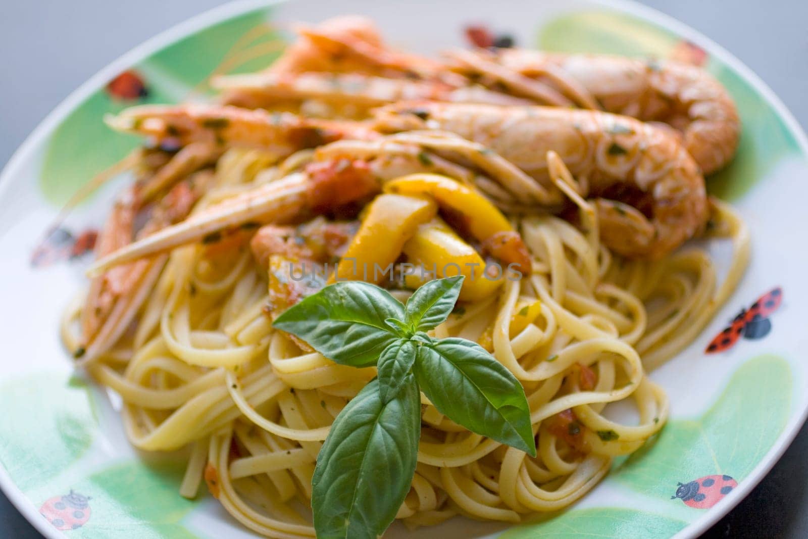 Italian spaghetti with tomato sauce, basil and shrimp