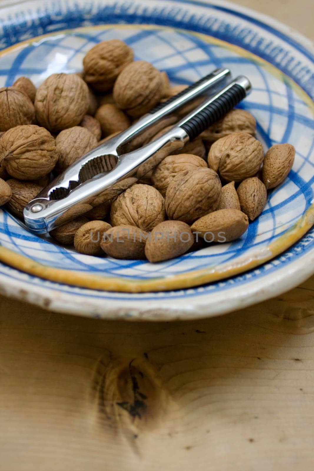 Walnuts and nut crackers inside a dish