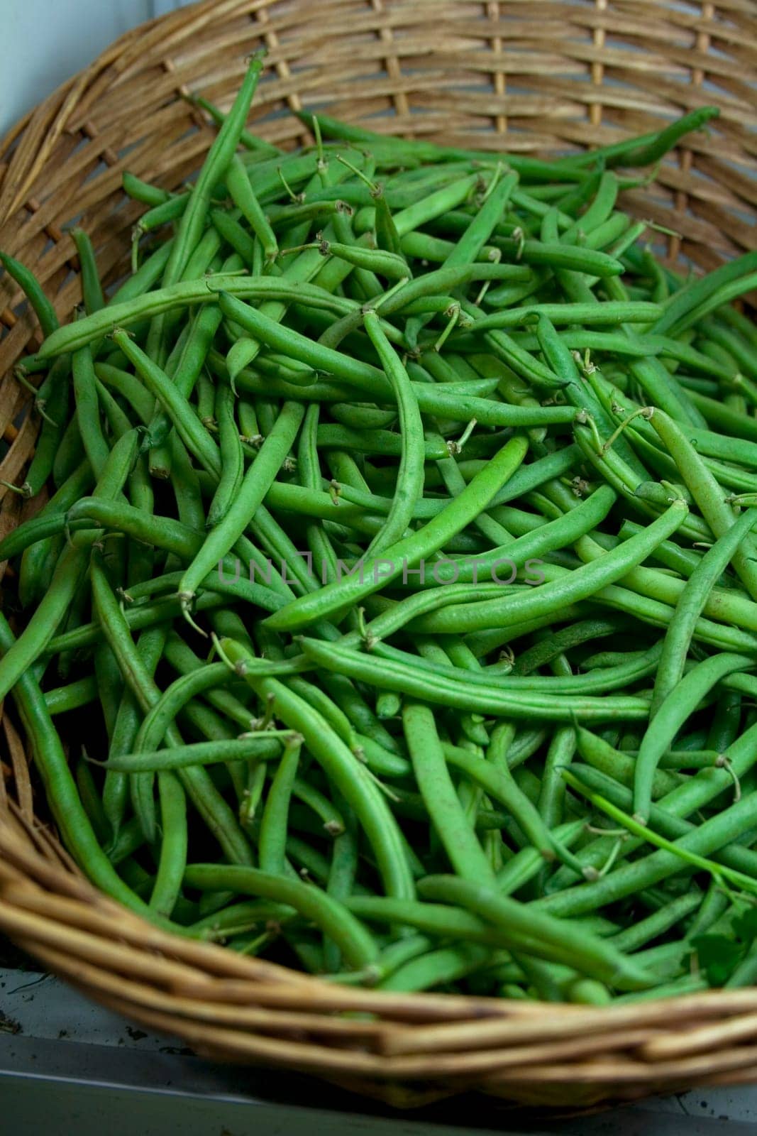 Fresh Green Beans inside a wicker basket