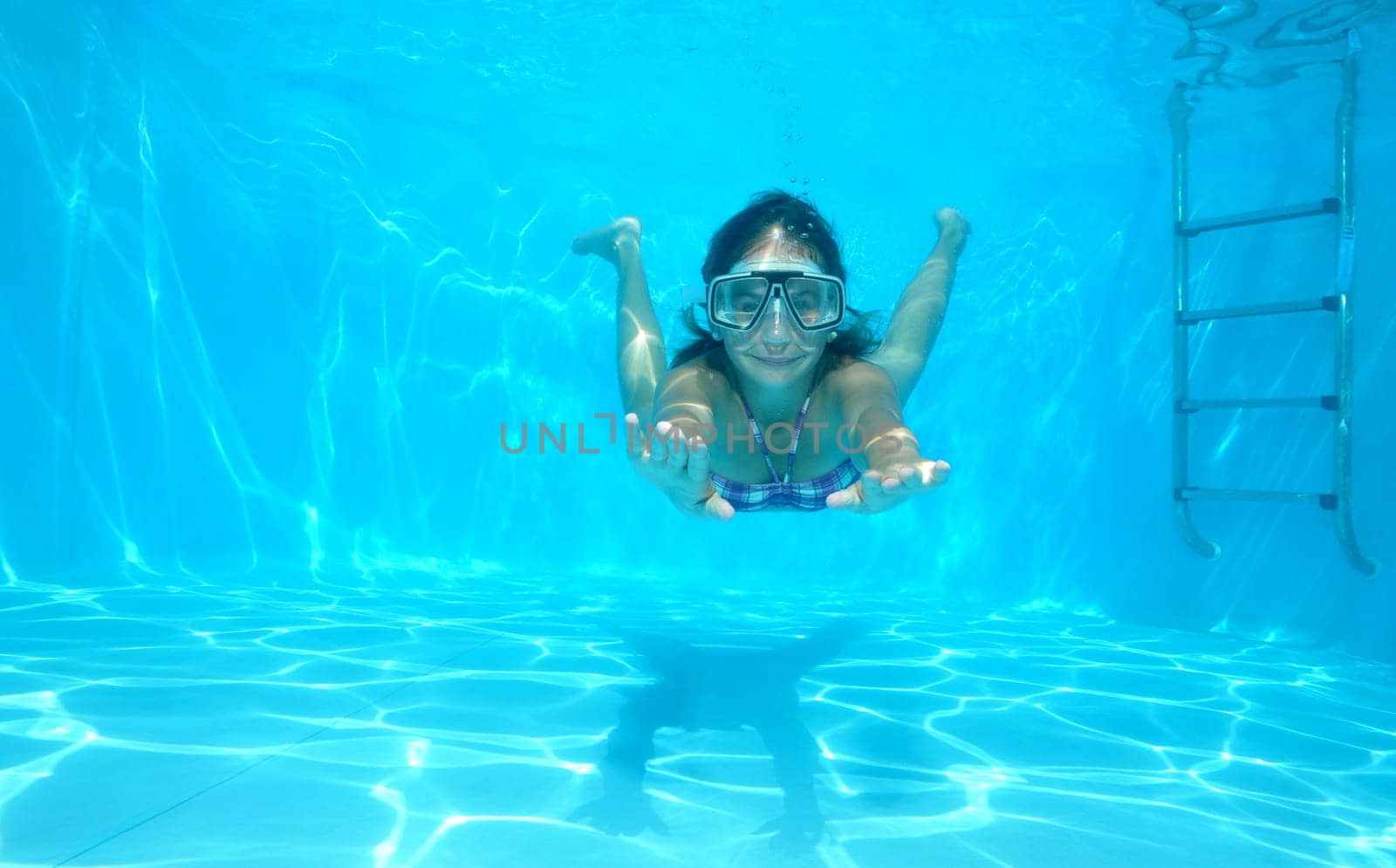 Girl swimming in the pool