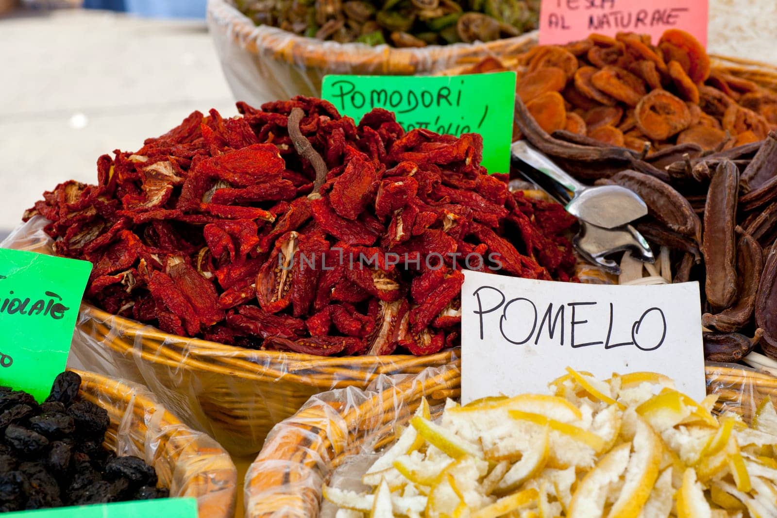 Dried tomatoes inside a wicker basket