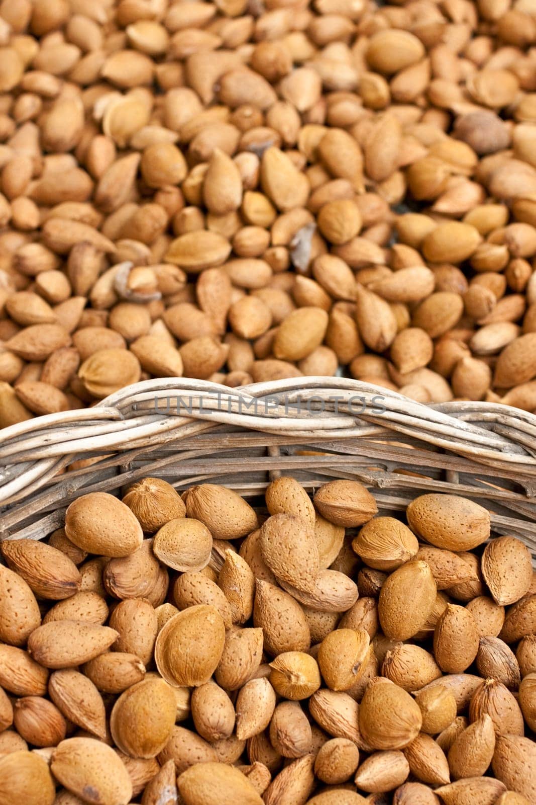 Photo of almonds inside a wicker basket