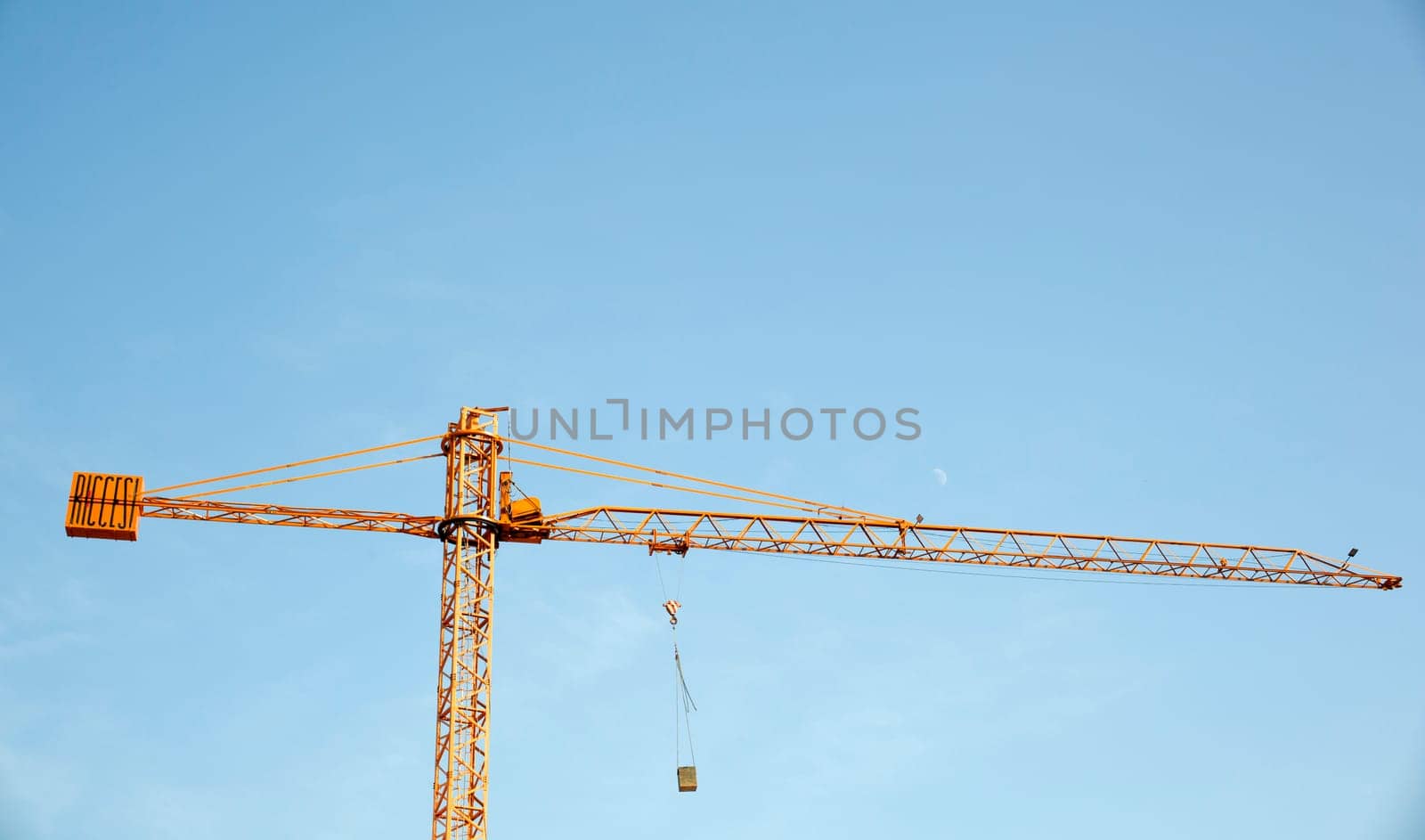 Yellow crane on blue sky