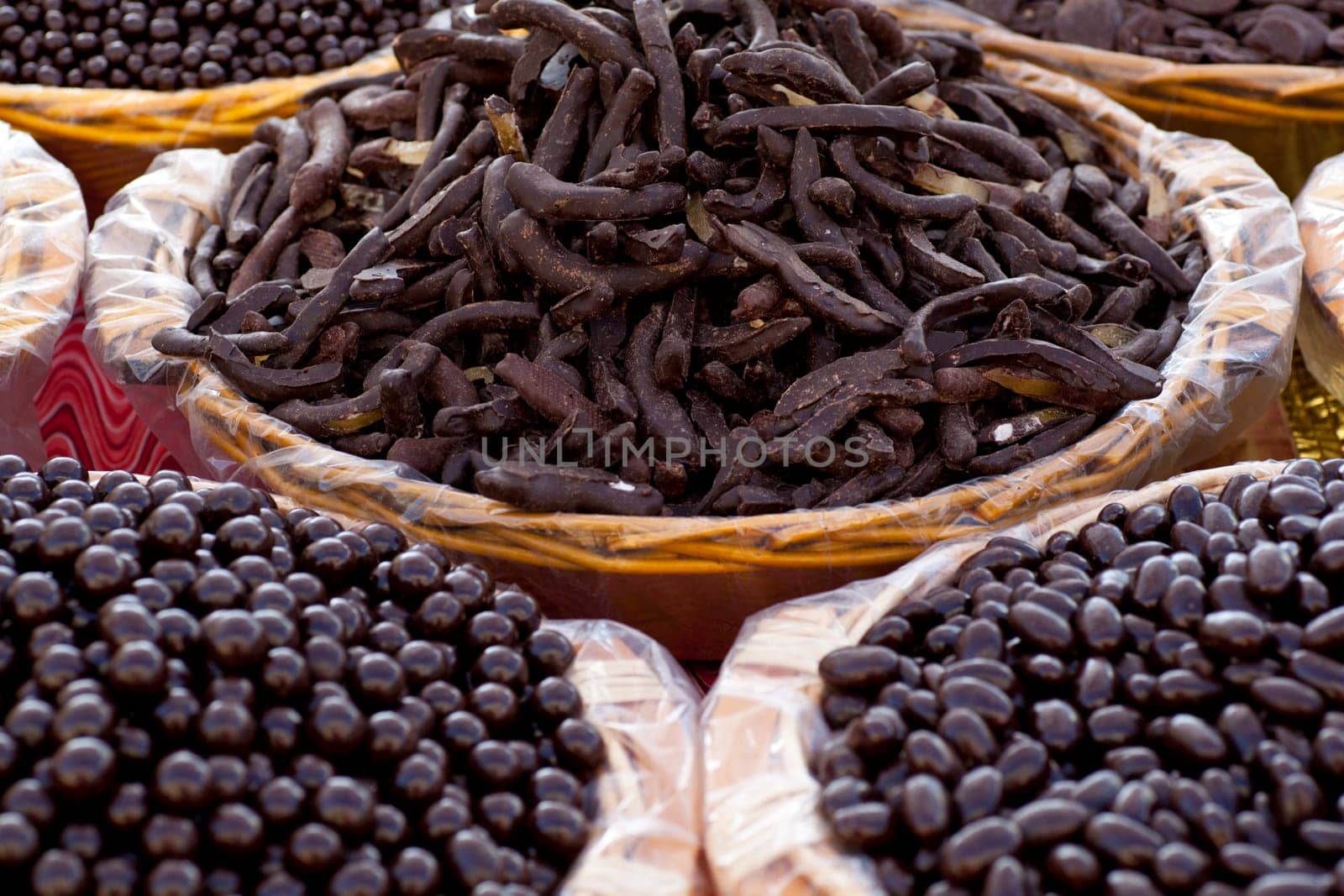 Various Chocolate inside a wicker baskets