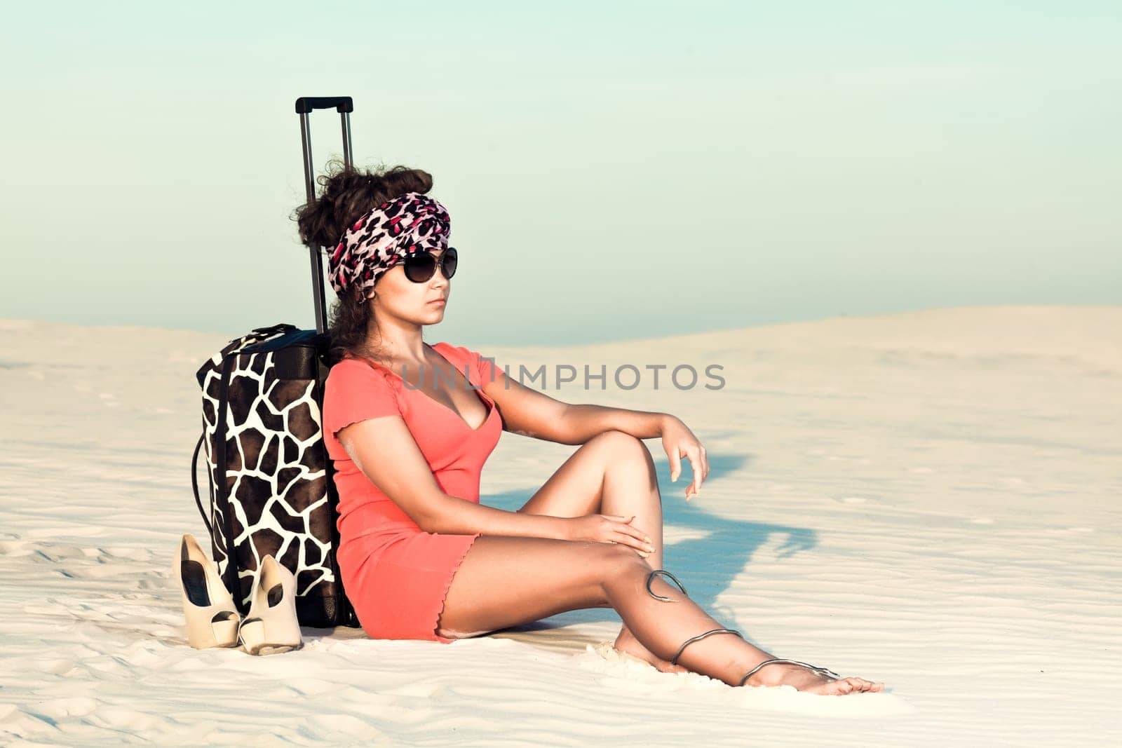 Beautiful woman with long hair in desert