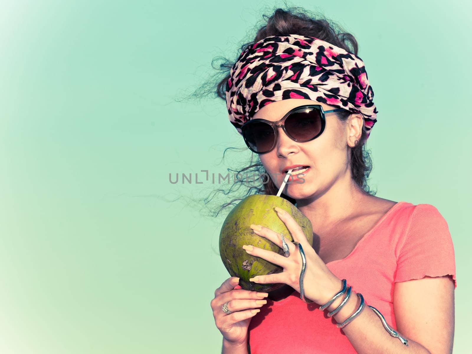Beautiful young woman with coconut