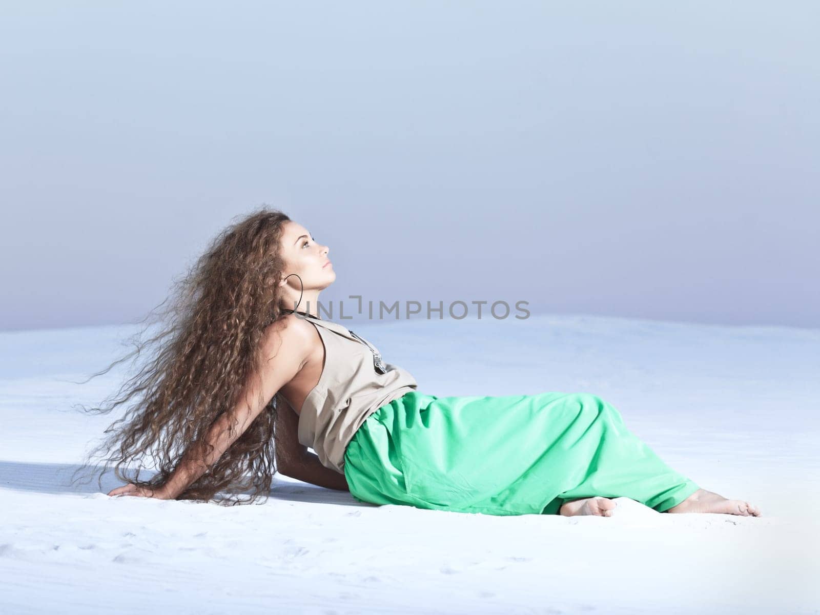 Beautiful woman in desert. Vanilla sunset