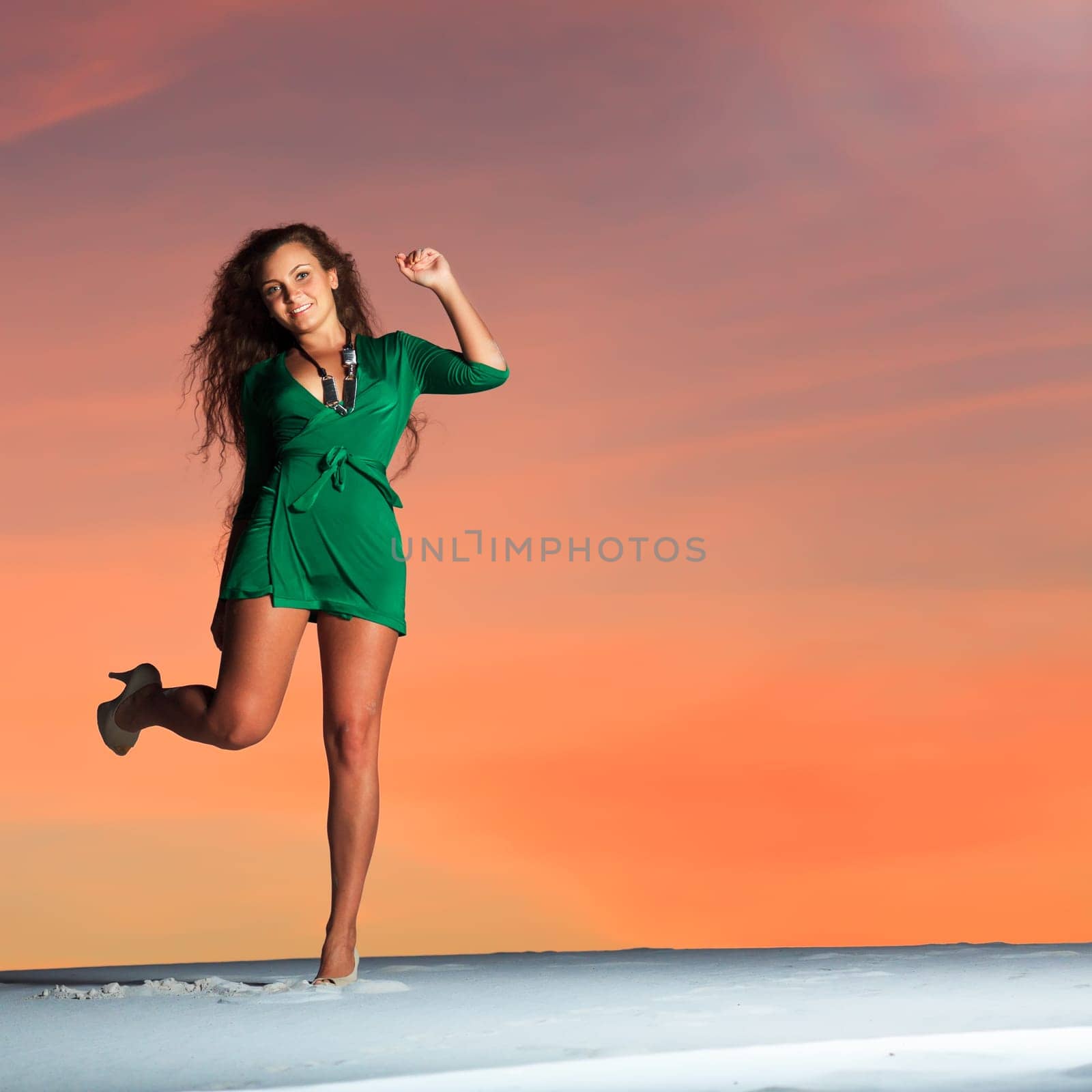 Beautiful woman dancing in desert