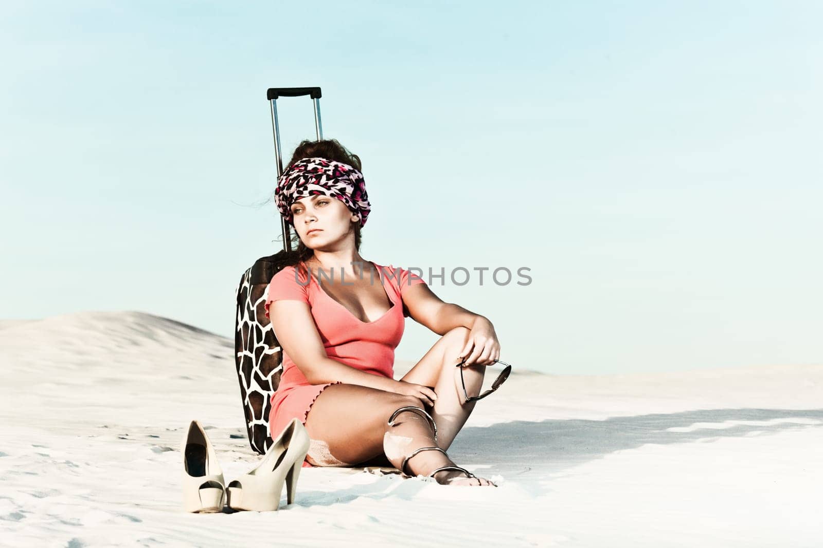 Beautiful woman with long hair in desert