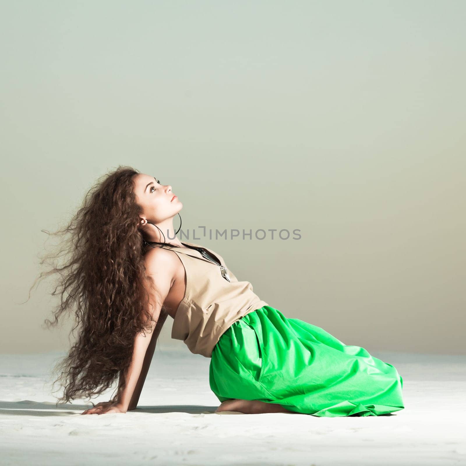 Beautiful woman with long hair in desert