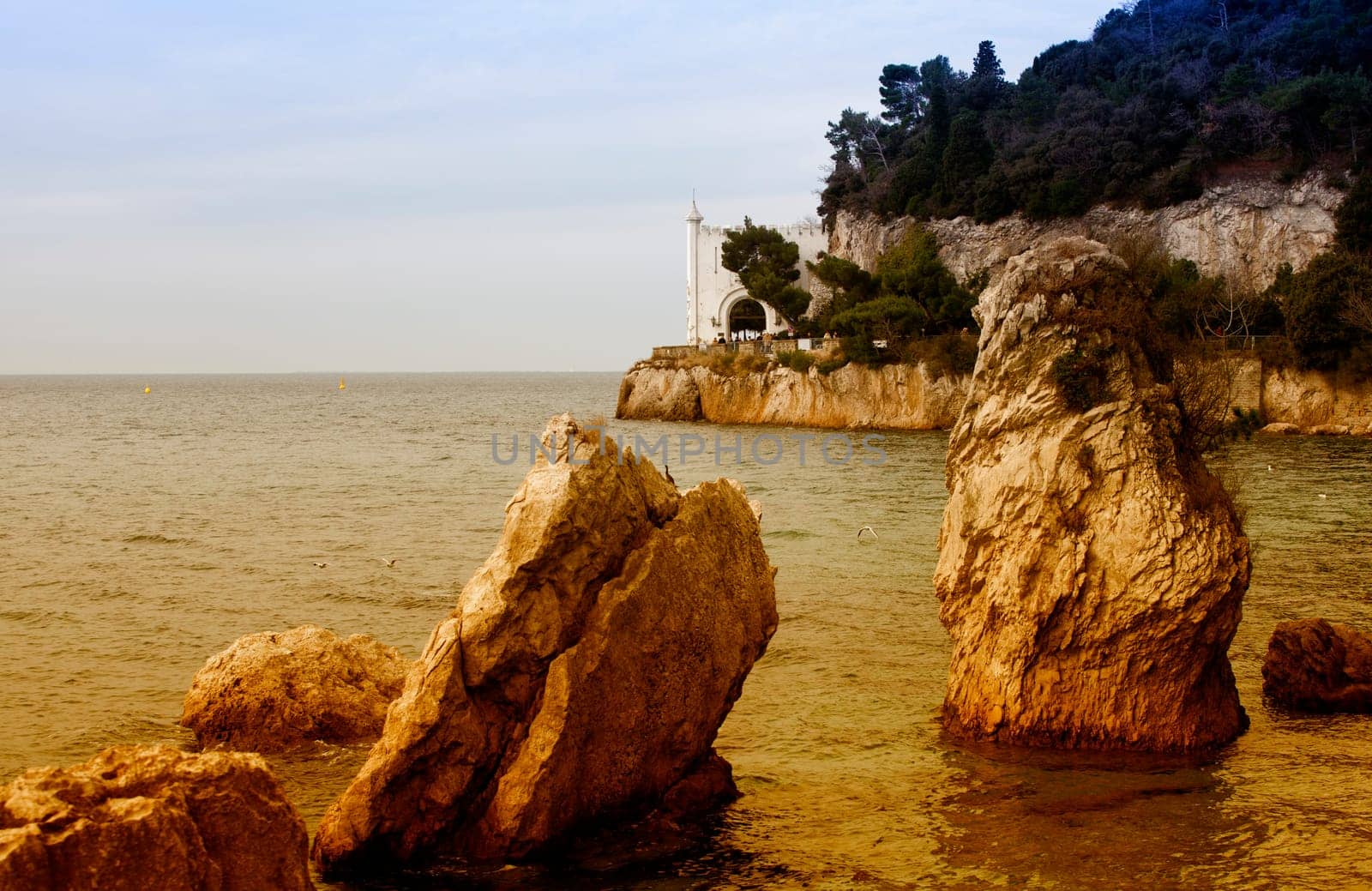 Rock on the sea, Miramare castle. Trieste - Italy